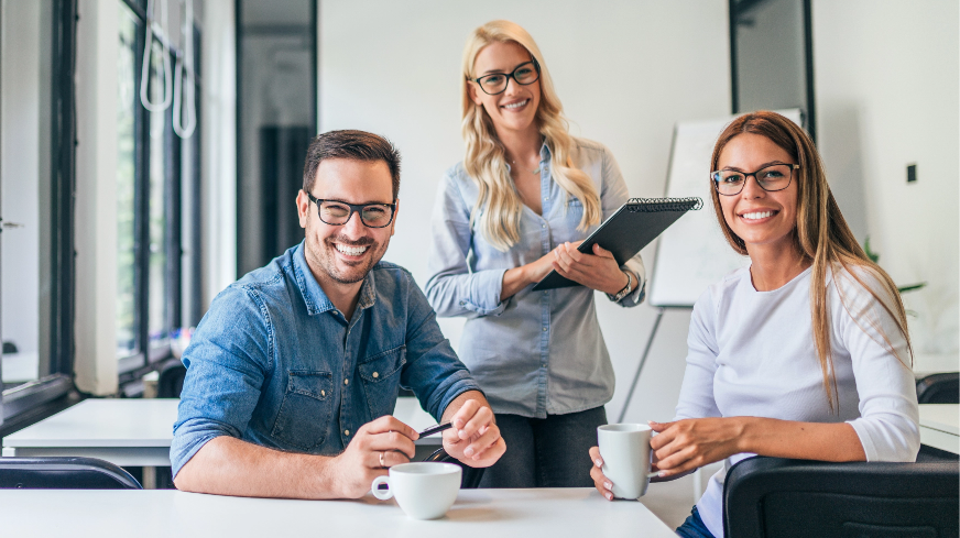 Agents smile at the beginning of a client meeting